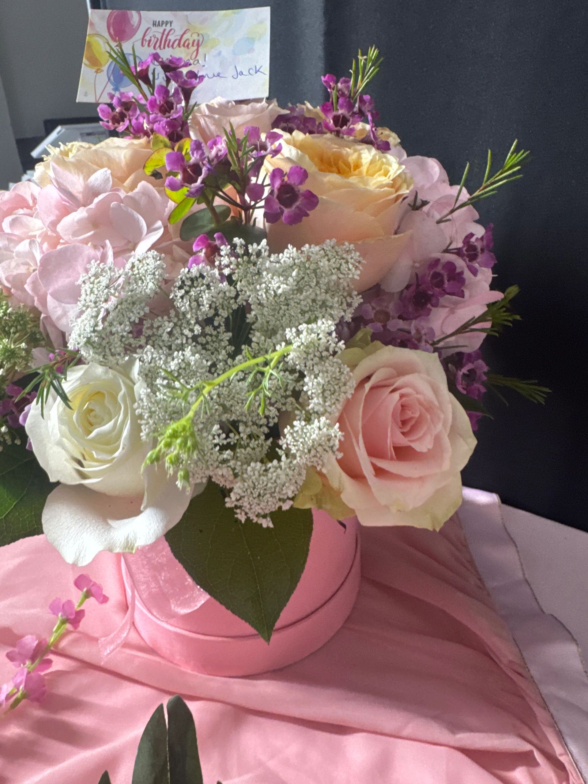 Pink roses birthday arrangement in ceramic vase